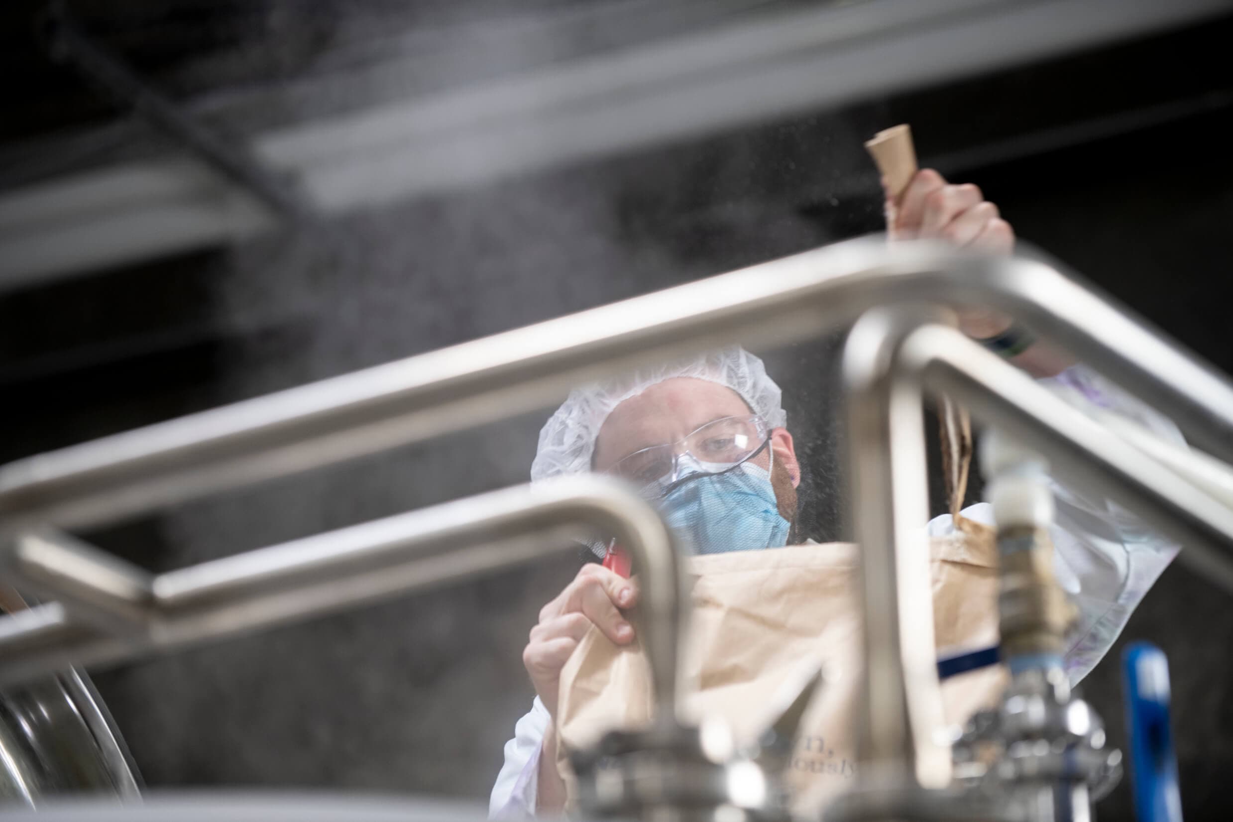 Brewer inspecting a batch of yeast.